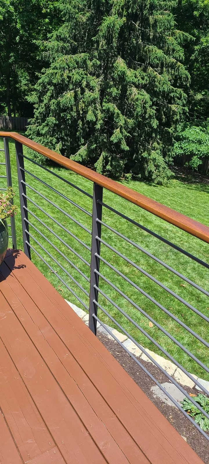 Cable railing detail overlooking the lawn