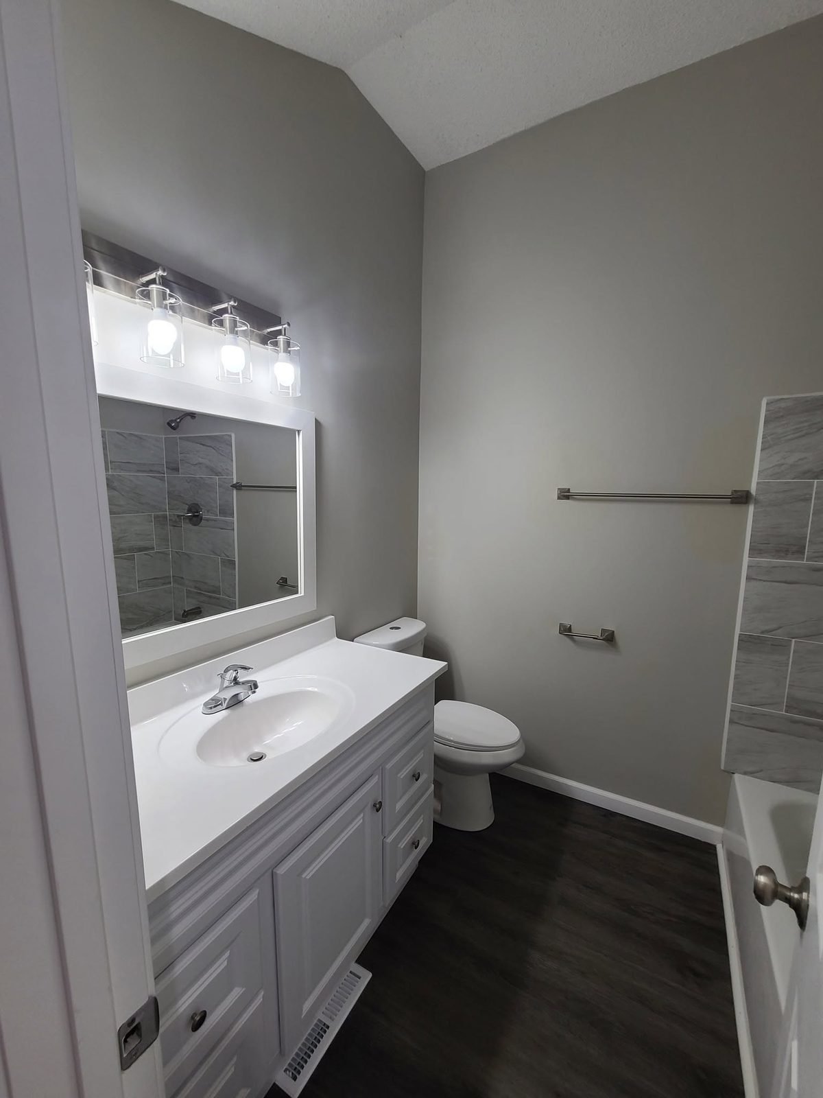 Remodeled bathroom with vanity and tub