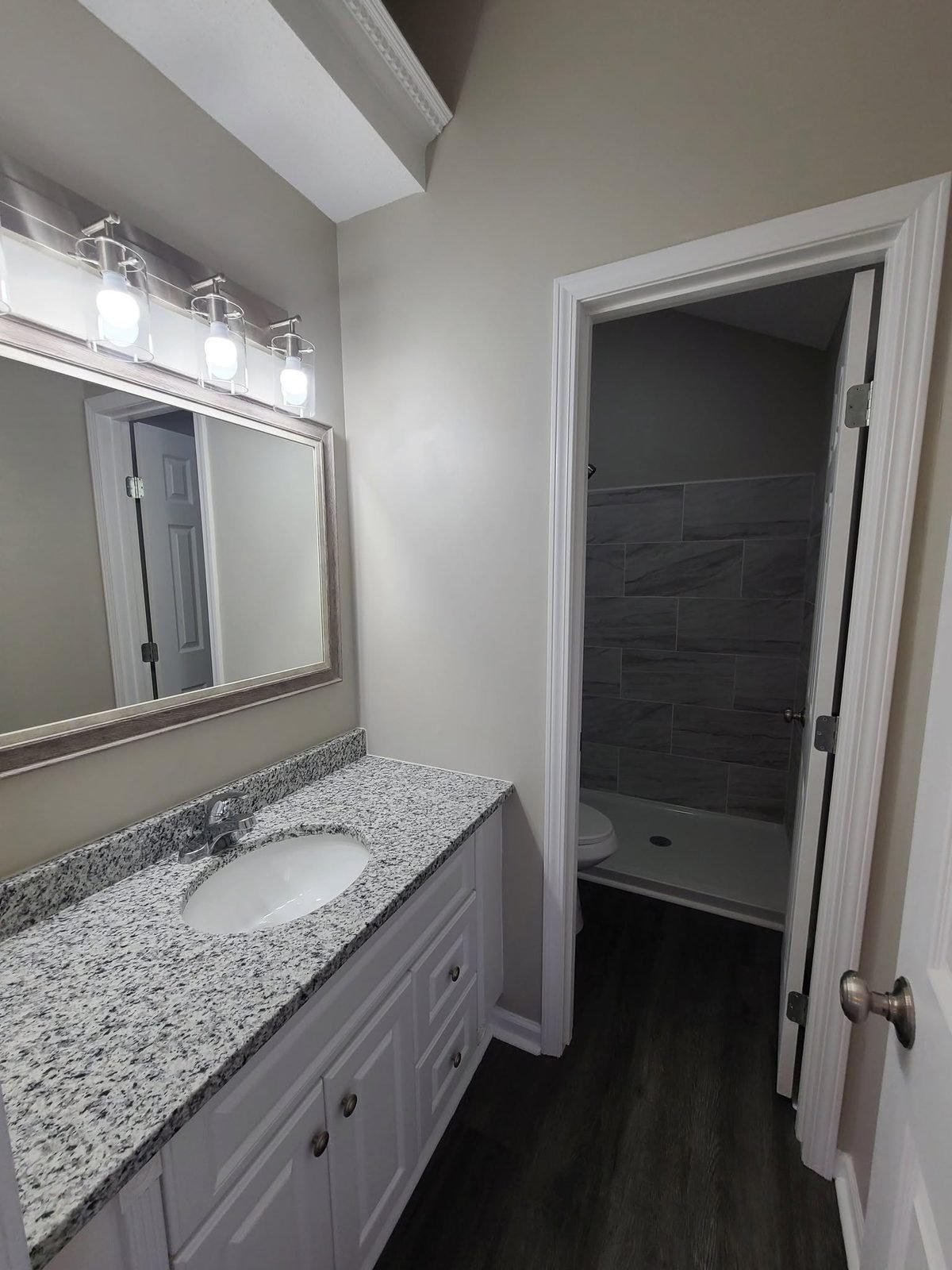 Remodeled bathroom with granite vanity