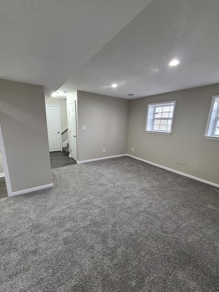 Finished basement with fresh paint and new carpet