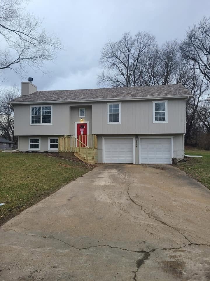 Finished exterior with fresh paint and a red front door