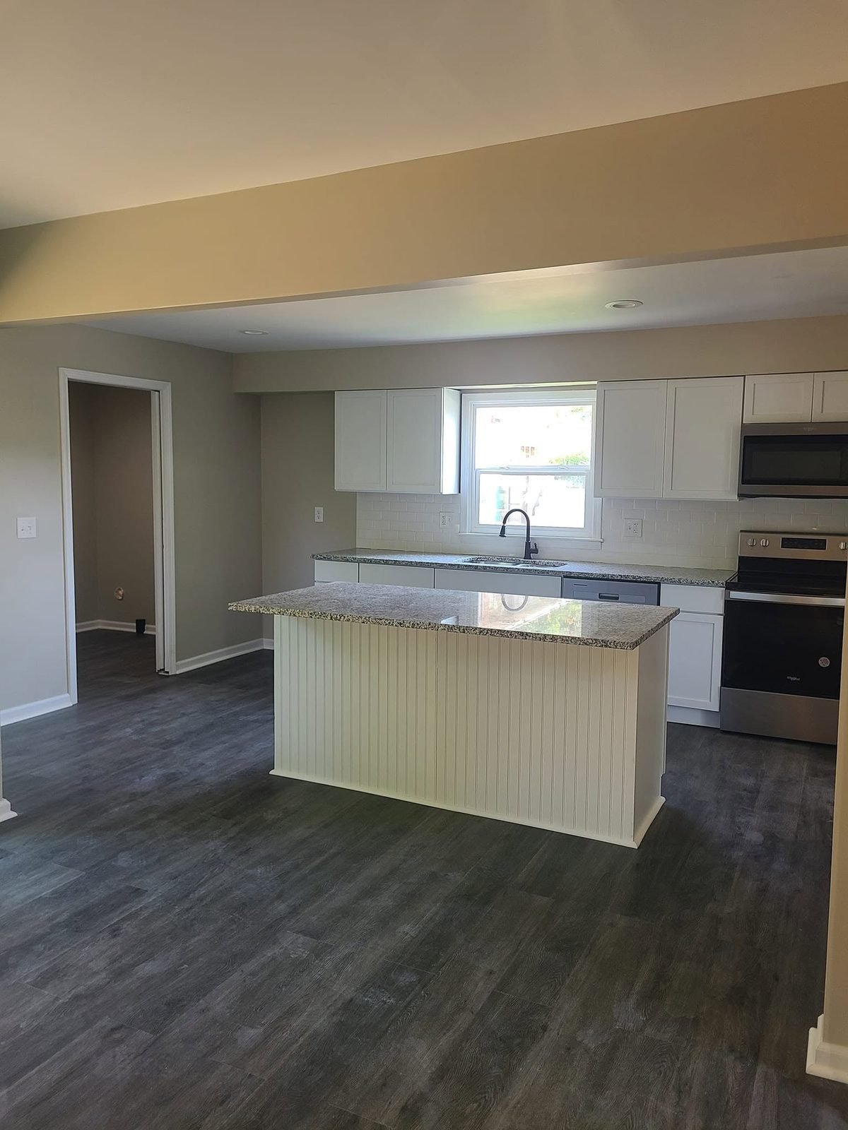 Open-concept kitchen with granite island