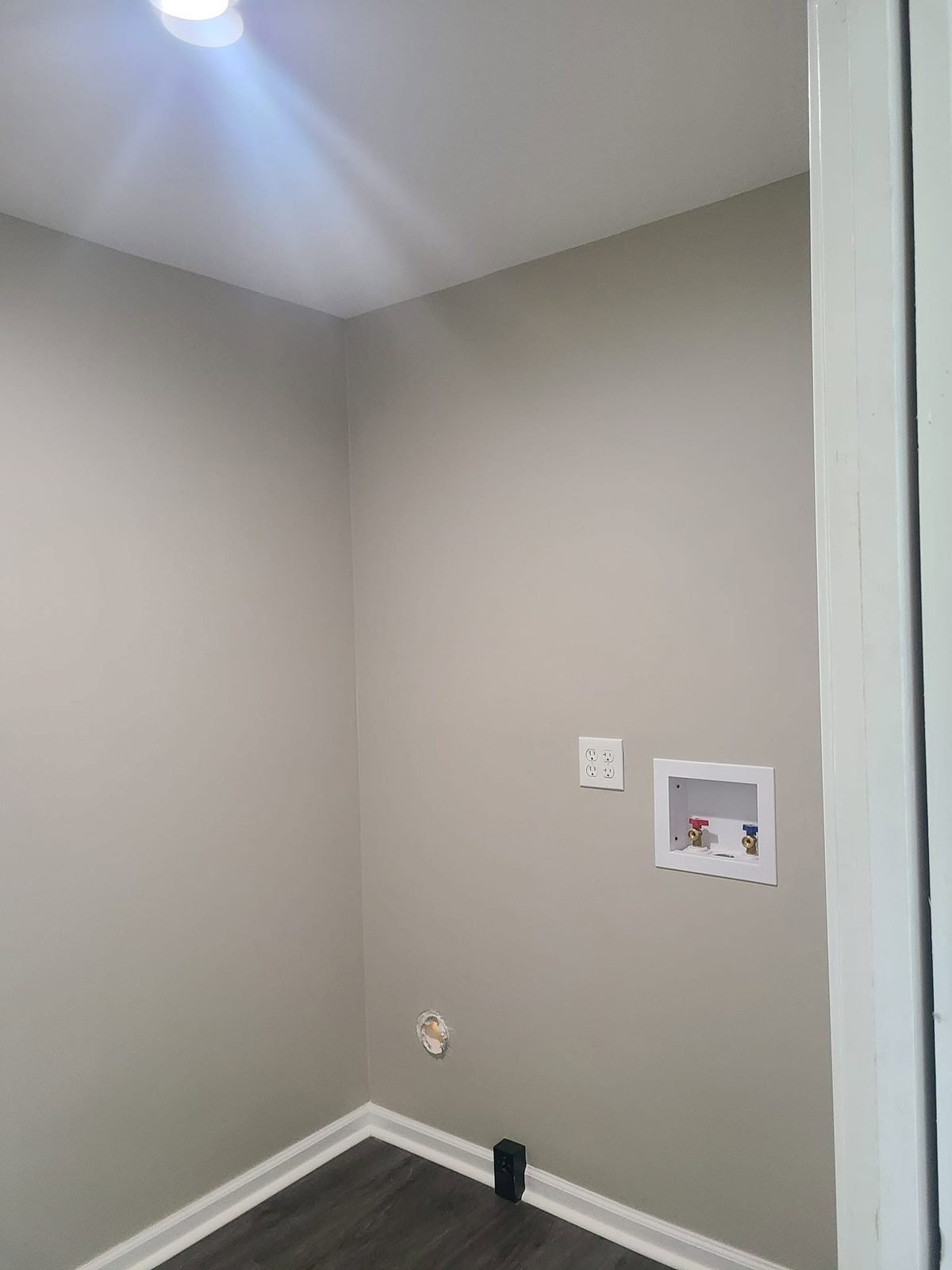 Laundry room with new hookups and fresh paint