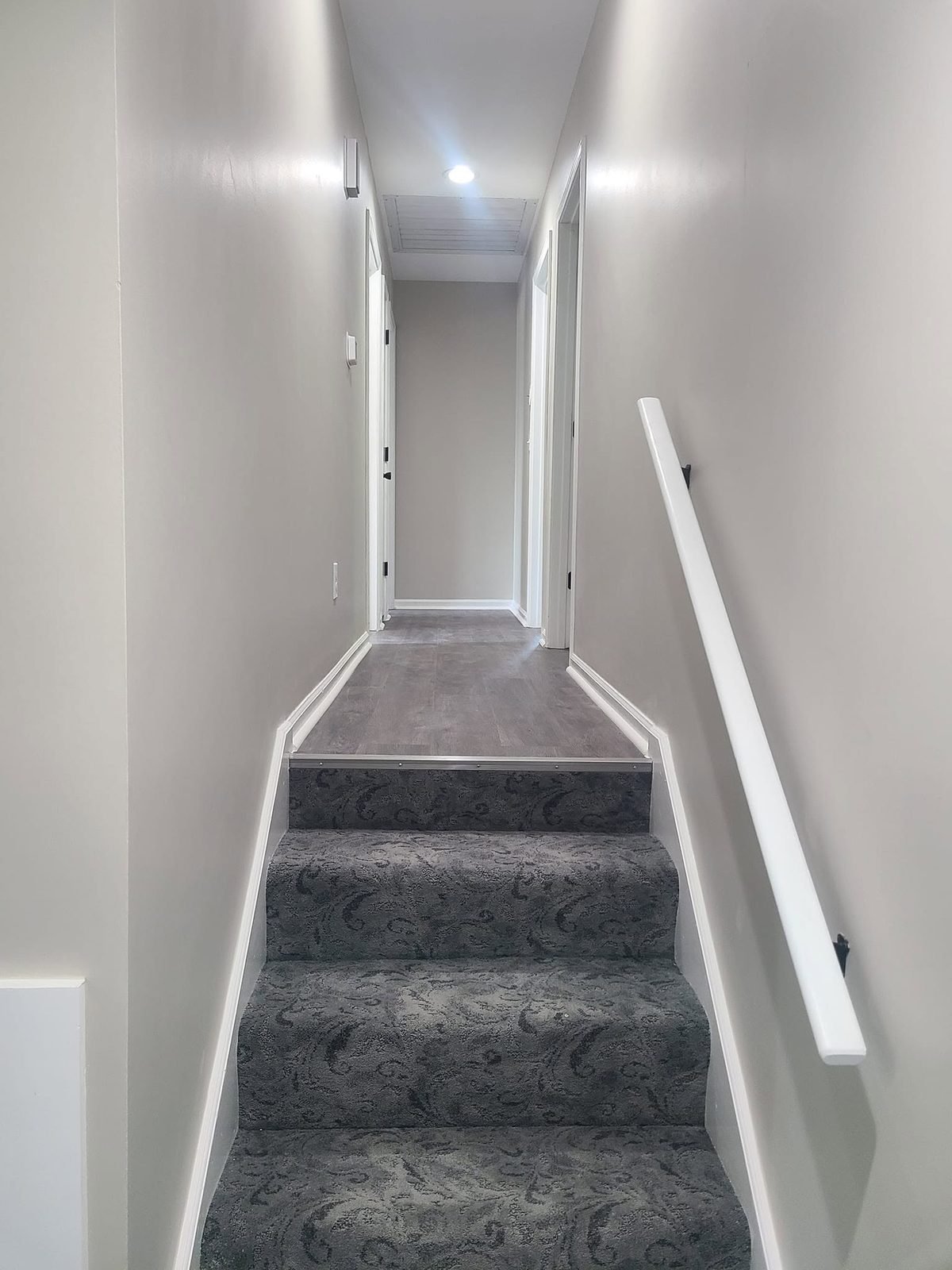 Hallway and stairs with fresh paint and new carpet