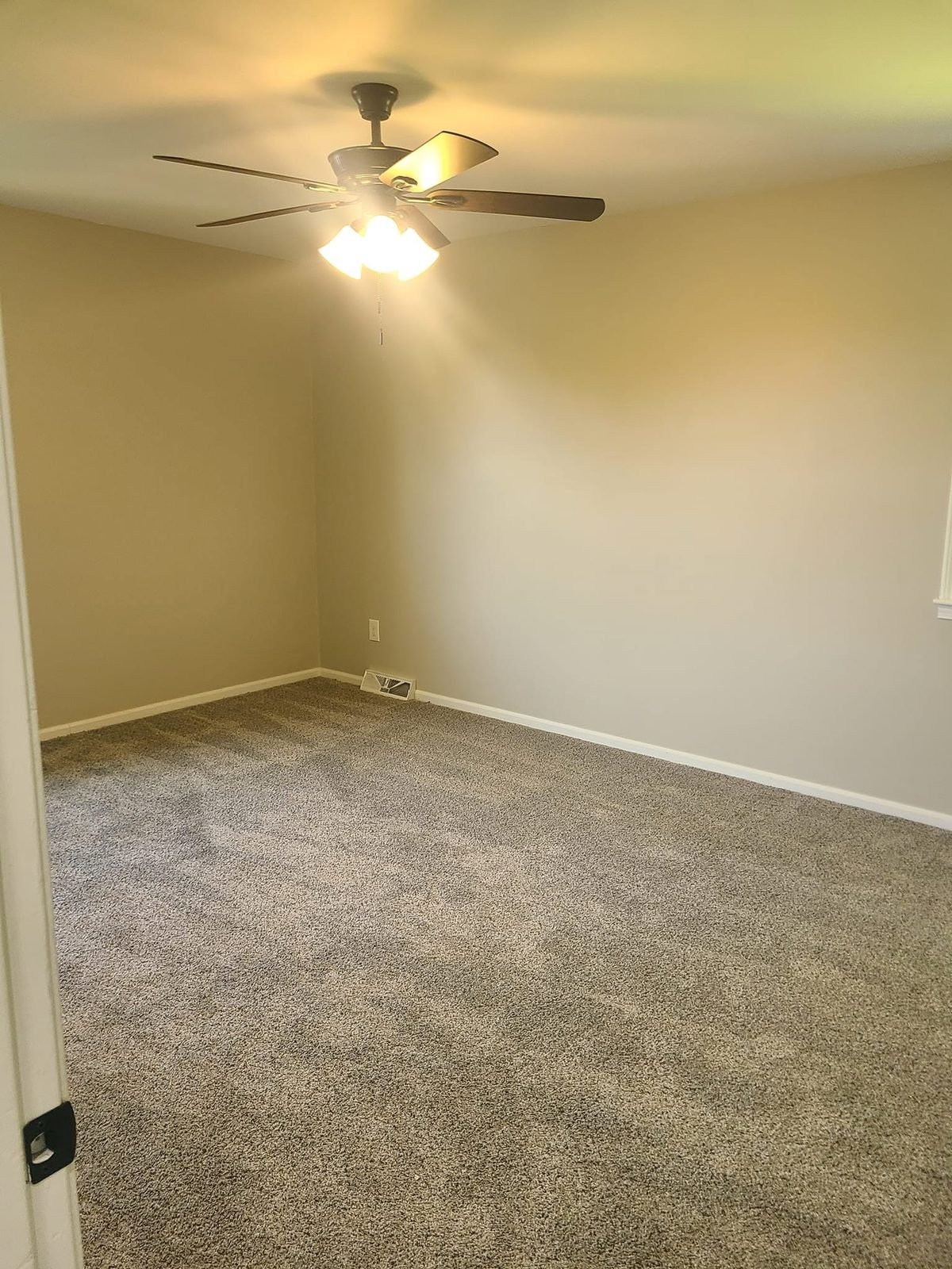 Bedroom with ceiling fan and carpet