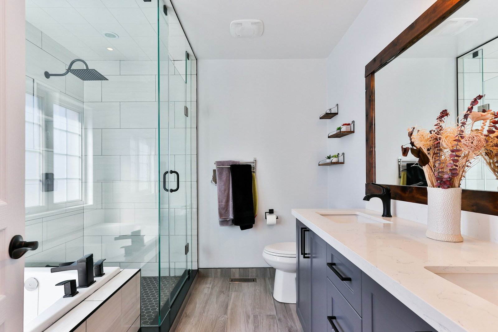 Bright remodeled bathroom with tile shower